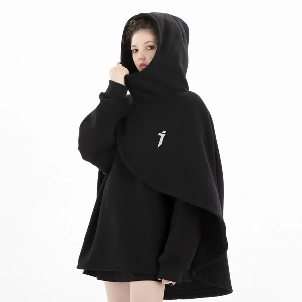 Person wearing a black hooded garment with a small white logo on a white background
